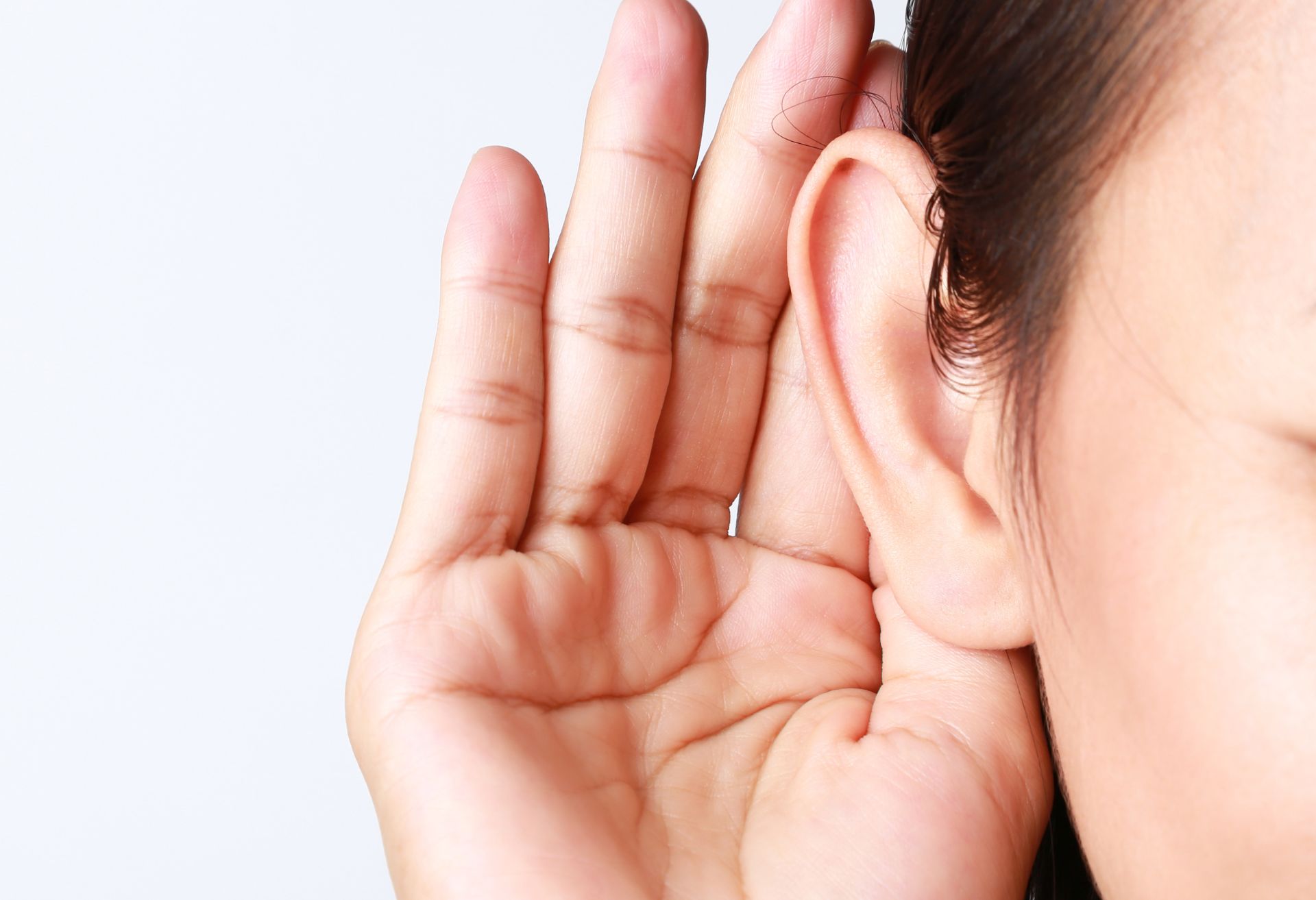 Image of a person cupping their ear to listen