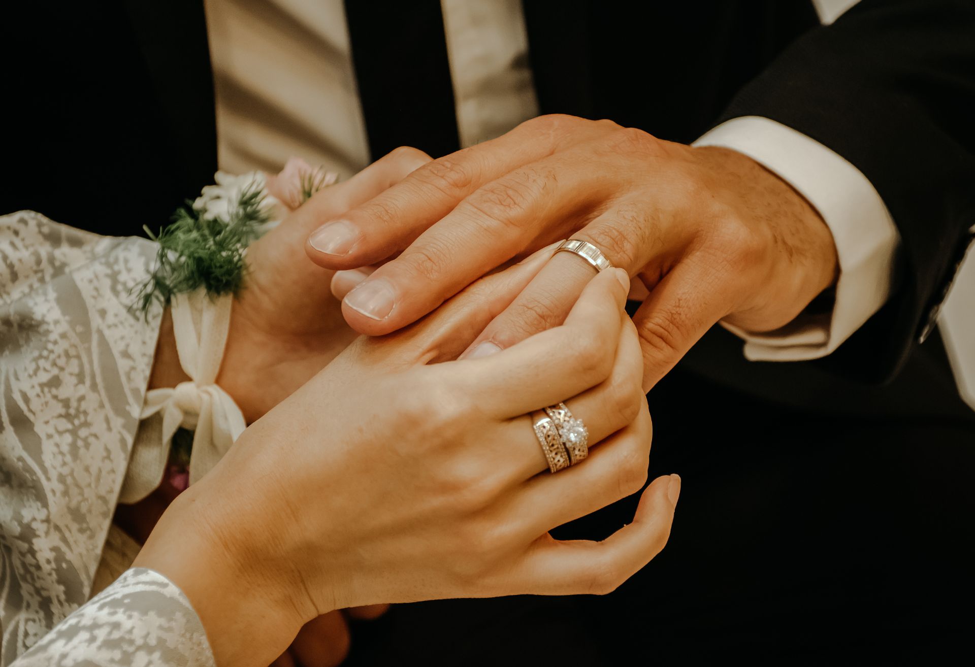 Close up image of hands of couple marrying